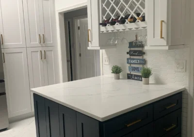 A traditional kitchen featuring rich wooden cabinets, a farmhouse sink, and warm lighting.