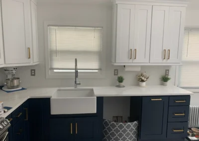 A modern kitchen featuring open shelving and stainless steel appliances.