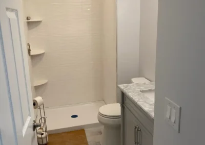 A modern bathroom equipped with a water-saving showerhead and smart controls.