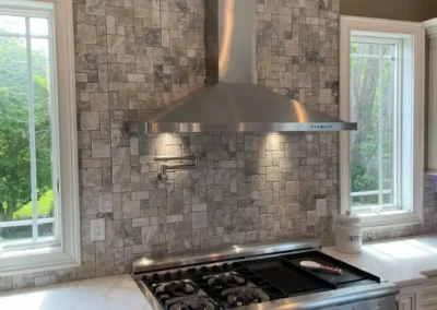 A high-tech kitchen featuring smart appliances and touchless faucets.