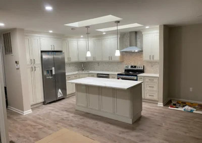 A vintage-style kitchen featuring retro pastel-colored appliances and checkerboard flooring.