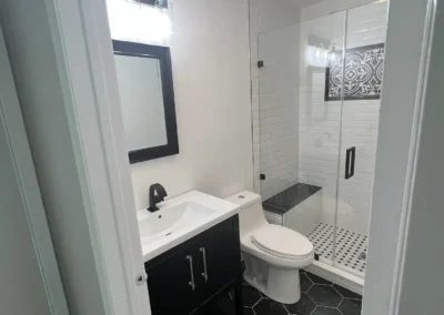 An elegant bathroom featuring a freestanding copper bathtub and brass fixtures.