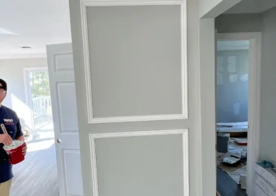 A luxurious bathroom with a waterfall-style shower and textured slate walls.