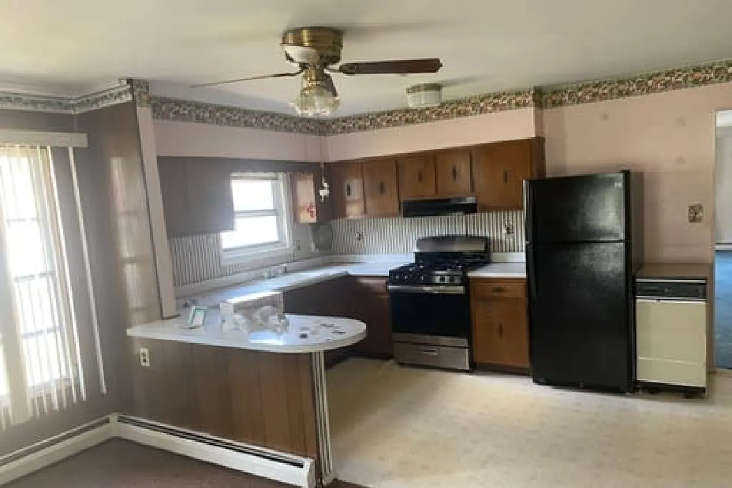 Open Shelving Kitchen A stylish kitchen with open wooden shelves and glass accents.